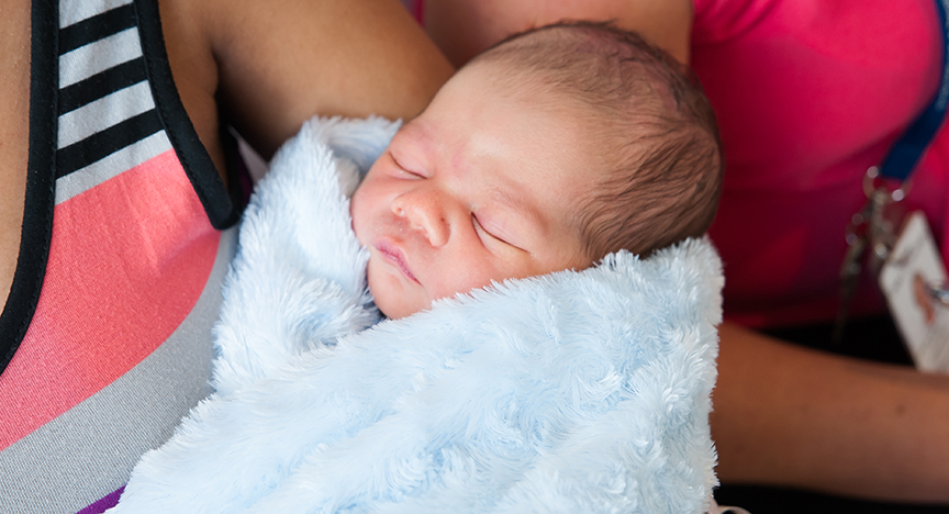 Newborn baby wrapped in blanket