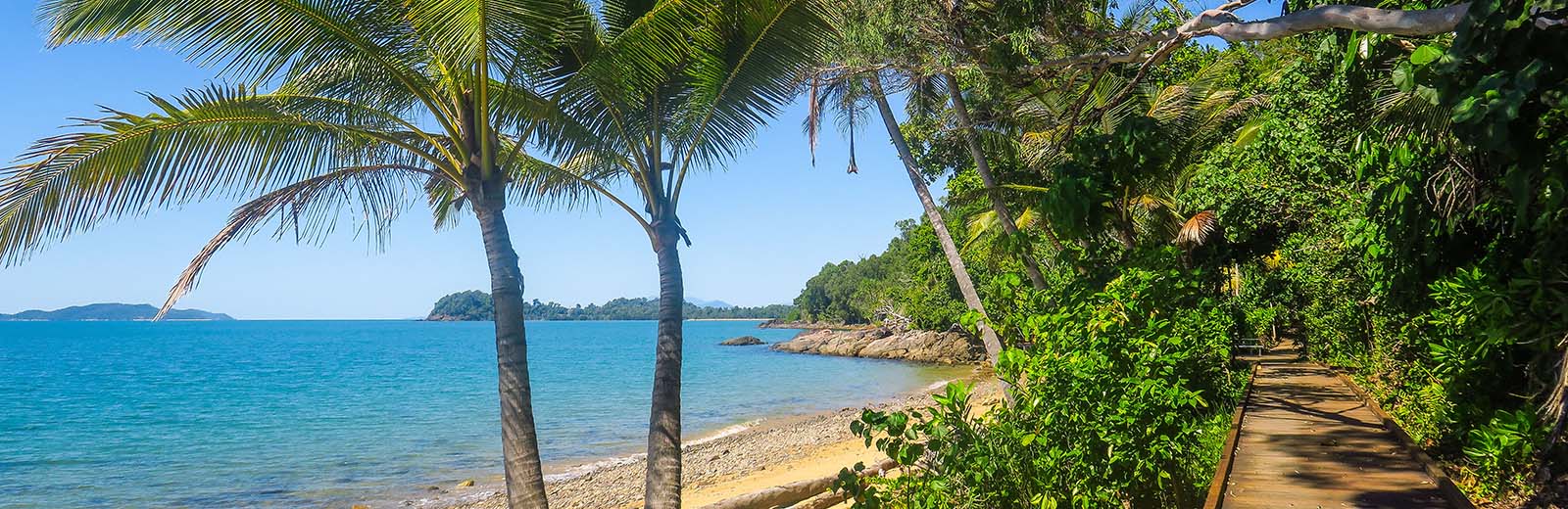 View of sunny, coastal beach on the Cassowary Coast