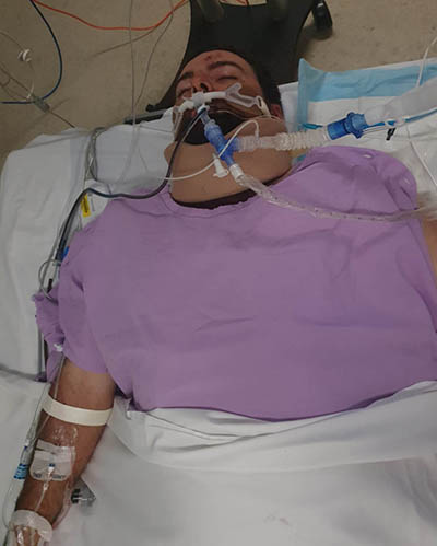 Danyon lying in emergency hospital bed