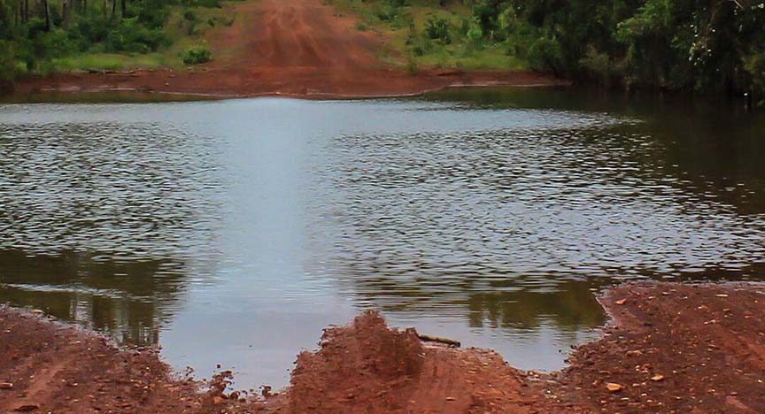 Water flooding over dirt road