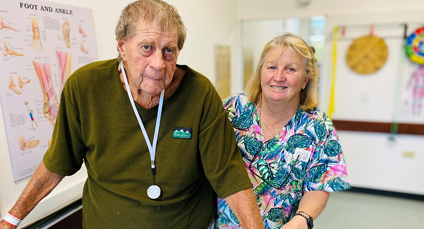 OPERA patient Earl Ross with allied health assistant Di Spencer in the new therapy room at Mareeba Hospital